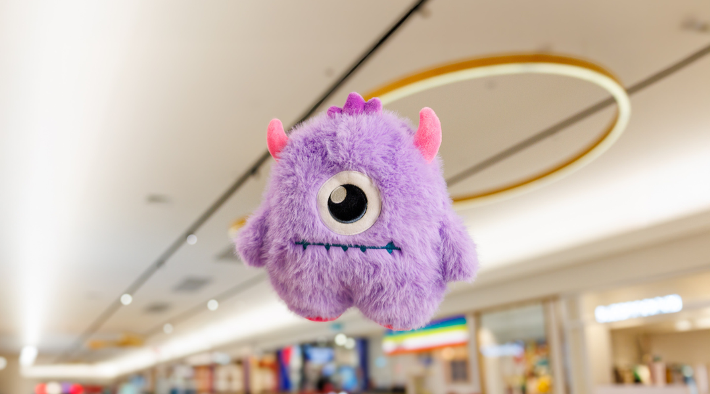 A purple monster floating in the air at The Pines Elanora.