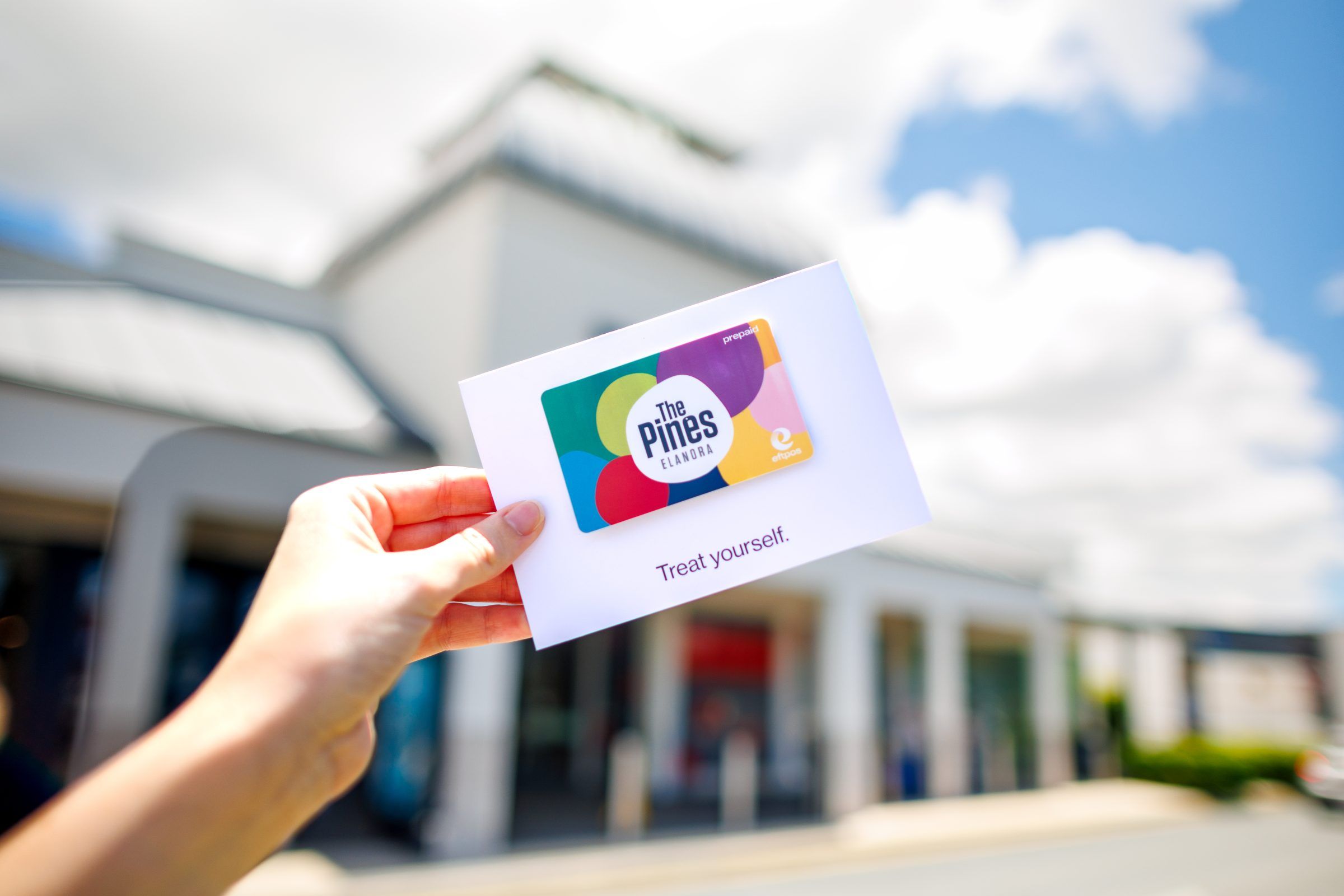 A photo of a Pines Elanora Gift Card for the school holiday activation survey.